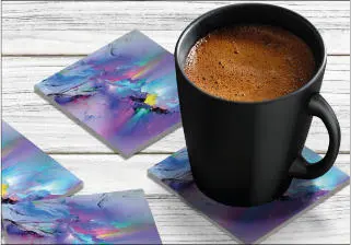 An acrylic coaster in the Rainbow Rain Mountain design