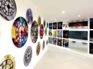 Free gift lifestyle image showing a wall display of glass wall clocks.